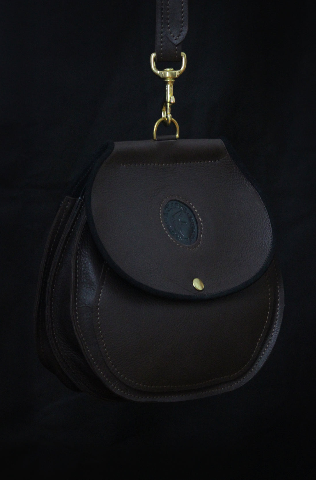 Falconry bag in dark brown with black trim