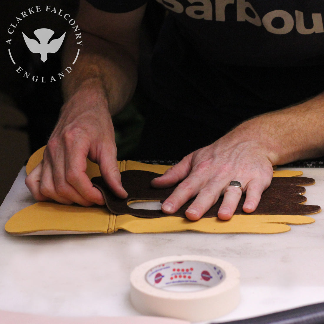 Bespoke gloves in the making featuring a custom gold logo...