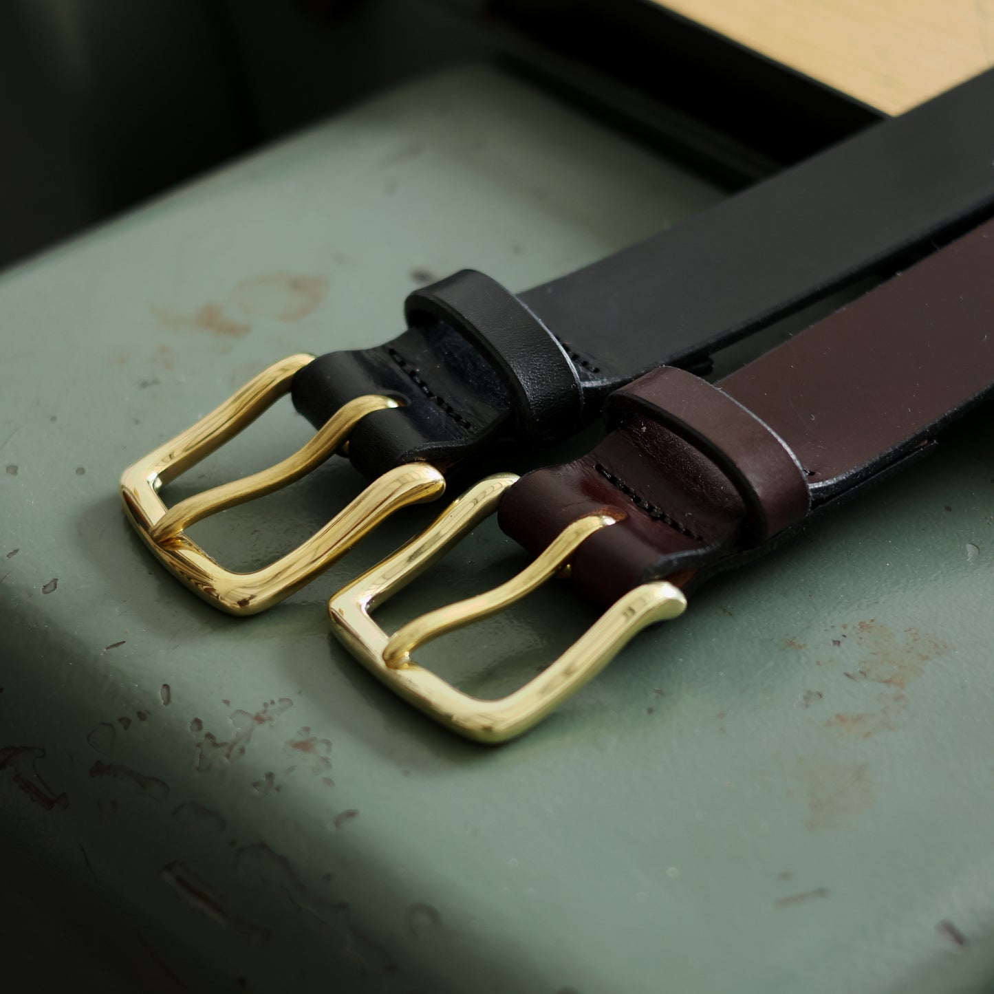 Close-up of bridle leather belt keepers and buckles