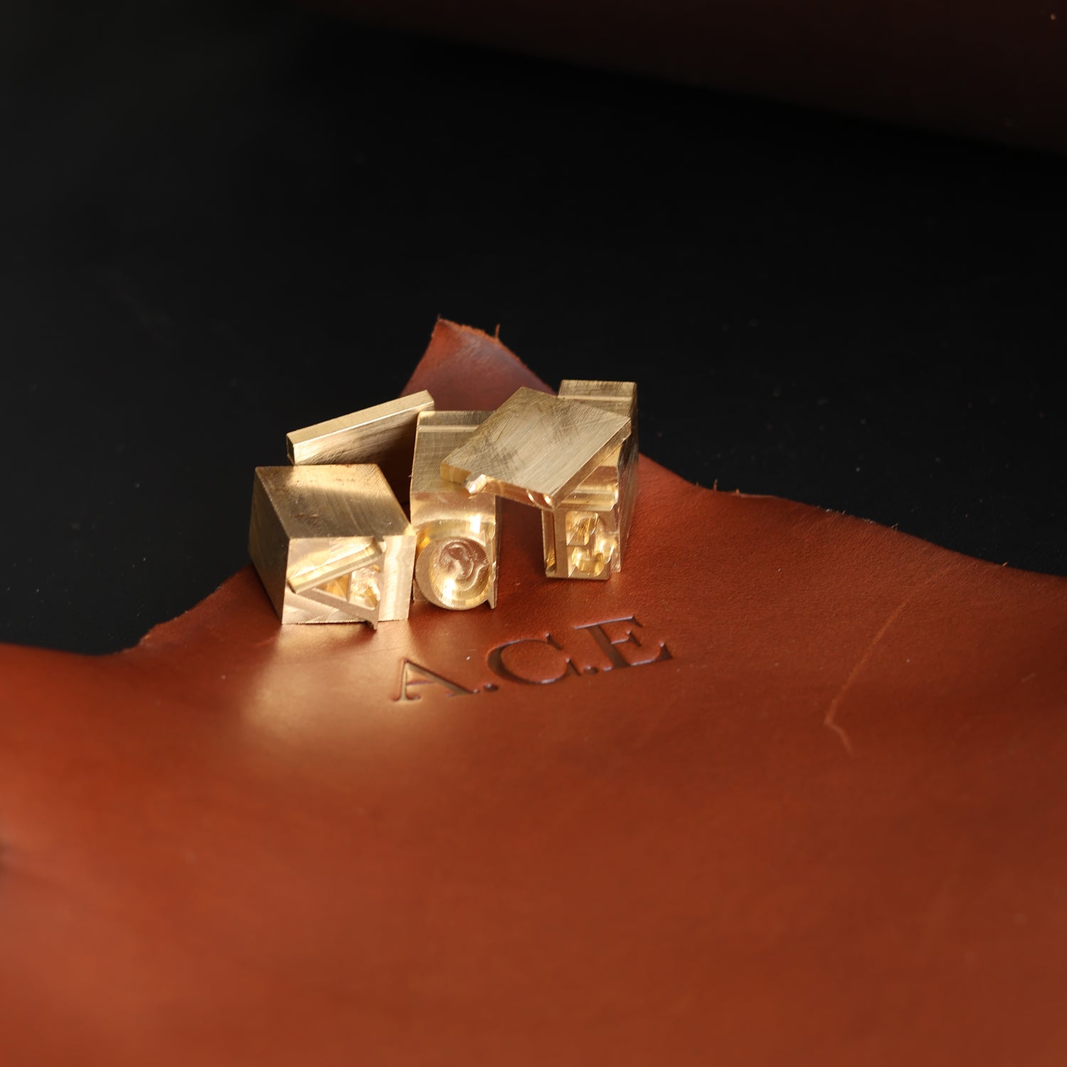 Initials stamped into leather for Bellmount Cartridge Bag personalisation