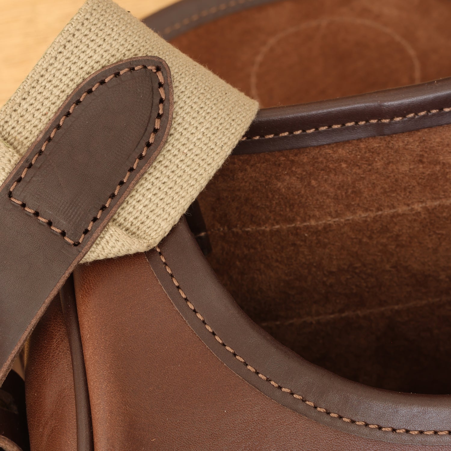 Vegetable-tanned leather, suede lining and woven cotton strap
